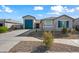 Front view of house with driveway and landscaping at 2860 N Riverdale Ln, Casa Grande, AZ 85122