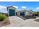 House exterior, two-car garage, and desert landscaping at 2860 N Riverdale Ln, Casa Grande, AZ 85122