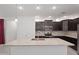 Modern kitchen with dark cabinets and granite countertops at 2860 N Riverdale Ln, Casa Grande, AZ 85122