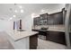 Granite kitchen island with sink and stainless steel appliances at 2860 N Riverdale Ln, Casa Grande, AZ 85122