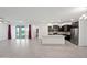 Open concept kitchen with granite countertops and dark cabinetry at 2860 N Riverdale Ln, Casa Grande, AZ 85122