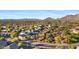 Aerial view of a community with desert landscape and mountain views at 41319 N Panther Creek Ct, Anthem, AZ 85086