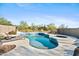 Relaxing pool and spa area with plenty of space for lounging at 41319 N Panther Creek Ct, Anthem, AZ 85086