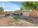 Large backyard with a grassy area, a storage shed, and a view of the pool at 4736 W Marconi Ave, Glendale, AZ 85306