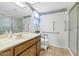 Bathroom with accessible shower, grab bars, and updated vanity at 4736 W Marconi Ave, Glendale, AZ 85306