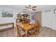 Dining area with a wooden table, chairs and view into kitchen at 4736 W Marconi Ave, Glendale, AZ 85306