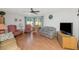 Living room with hardwood floors, comfortable seating, and a ceiling fan at 4736 W Marconi Ave, Glendale, AZ 85306