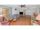 Spacious living area with hardwood floors, ceiling fan and access to patio at 4736 W Marconi Ave, Glendale, AZ 85306