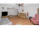 Living room with hardwood floors, comfortable seating, and a ceiling fan at 4736 W Marconi Ave, Glendale, AZ 85306