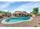 Inviting kidney shaped pool with patio and desert landscaping at 4736 W Marconi Ave, Glendale, AZ 85306