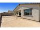 Backyard of house with large covered patio and block wall at 5515 N 193Rd Ave, Litchfield Park, AZ 85340