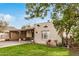 House exterior showcasing a covered porch, well-maintained lawn, and a paved driveway at 601 W Mohave St, Phoenix, AZ 85003