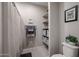 Clean bathroom with shower, linen storage, and a toilet at 613 N 108Th Ave, Avondale, AZ 85323