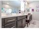 Double vanity bathroom with modern dark brown cabinets at 613 N 108Th Ave, Avondale, AZ 85323