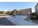 Single-story home with attached garage and landscaped front yard at 613 N 108Th Ave, Avondale, AZ 85323