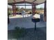 Covered patio area with picnic table and grill at 613 N 108Th Ave, Avondale, AZ 85323