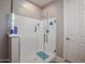 Walk-in shower with glass enclosure and tiled surround at 613 N 108Th Ave, Avondale, AZ 85323