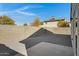 Backyard with gravel, concrete patio, and block wall at 619 E Jensen St # 75, Mesa, AZ 85203