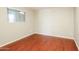 Bright bedroom with wood floors and large closet at 6219 S 12Th Pl, Phoenix, AZ 85042