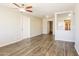 Bright living room featuring hardwood floors and a ceiling fan at 6219 S 12Th Pl, Phoenix, AZ 85042