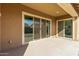 Covered patio with sliding glass doors leading to the backyard at 6509 W Hunter Ct, Phoenix, AZ 85083