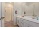 Modern bathroom with double sinks, shower, and tile floor at 6509 W Hunter Ct, Phoenix, AZ 85083