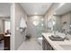 Updated bathroom featuring double sinks, a walk-in shower, and elegant tile at 6620 N 79Th Pl, Scottsdale, AZ 85250