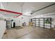 Organized garage with storage shelving and overhead rack at 6620 N 79Th Pl, Scottsdale, AZ 85250