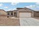 Two-story house with attached garage and driveway at 719 N Havasupai Ln, Coolidge, AZ 85128