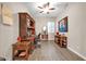 Bright home office with wood desk and hardwood floors at 7407 W Tether Trl, Peoria, AZ 85383