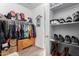 Large walk-in closet with shelving and hanging rods at 7718 W Raymond St, Phoenix, AZ 85043