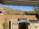 Outdoor kitchen with stainless steel appliances and pergola at 8083 E Autumn Sage Trl, Gold Canyon, AZ 85118