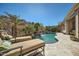 Relaxing pool area with lounge chairs and a tranquil waterfall feature at 8083 E Autumn Sage Trl, Gold Canyon, AZ 85118