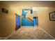 Open staircase with teal-colored risers leading to the second floor at 8841 W Cordes Rd, Tolleson, AZ 85353