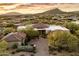 Luxury estate with a large courtyard and scenic mountain backdrop at 10384 E Loving Tree Ln, Scottsdale, AZ 85262