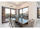 Bright dining area with modern table and chairs, offering scenic views at 10384 E Loving Tree Ln, Scottsdale, AZ 85262