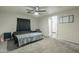 Bedroom with double bed, ceiling fan and ensuite bathroom at 1113 N Cota Ln, Coolidge, AZ 85128