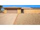 Brick ranch house with a two-car garage and desert landscaping at 12822 W Prospect Dr, Sun City West, AZ 85375