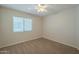 Spacious bedroom with neutral walls and carpeted floors at 13478 W Statler St, Surprise, AZ 85374