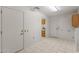 Laundry room with access to kitchen and exterior at 15008 W Greystone Dr, Sun City West, AZ 85375