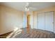 Well-lit bedroom featuring wood-look tile floors and double door closet at 15110 E Palomino Blvd, Fountain Hills, AZ 85268