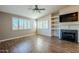 Living room with wood-look tile floors and a fireplace at 15110 E Palomino Blvd, Fountain Hills, AZ 85268