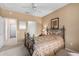 Bedroom featuring a ceiling fan and access to hallway at 17770 W Calistoga Dr, Surprise, AZ 85387