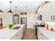 Kitchen with stainless steel appliances, white cabinets, and quartz countertops at 18035 W Muirwood Dr, Goodyear, AZ 85338