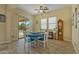 Casual dining area with backyard access and wood-look tile floors at 21999 E Camacho Rd, Queen Creek, AZ 85142