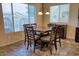 Bright dining area with a square table and six chairs, offering plenty of natural light at 2213 N Park Meadows Dr, Buckeye, AZ 85396