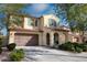 Two-story home with welcoming front porch and well-maintained landscaping at 2213 N Park Meadows Dr, Buckeye, AZ 85396