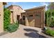 Front view of home with brick accents and a two-car garage at 29127 N 129Th Ave, Peoria, AZ 85383