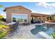 Inviting backyard oasis featuring a sparkling pool, patio, and outdoor kitchen at 29127 N 129Th Ave, Peoria, AZ 85383