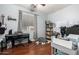 Bedroom with piano, bookshelves, and ample floor space at 3495 E Riopelle Ave, Gilbert, AZ 85298